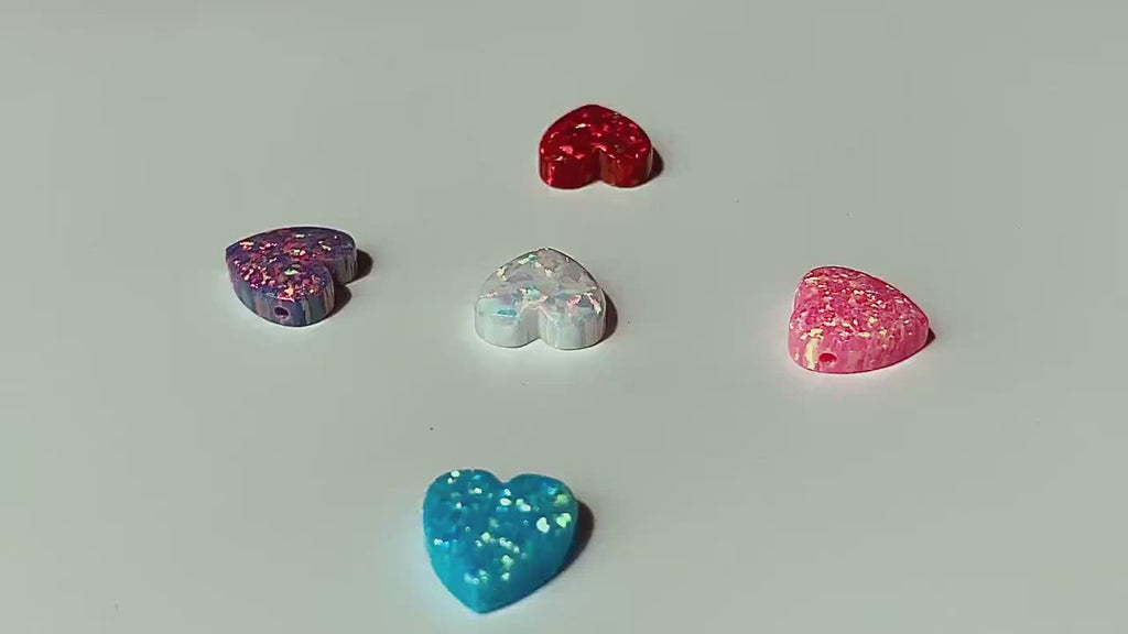 Opal heart. Lab creted opal hearts, colors: light blue, white pink and purple.